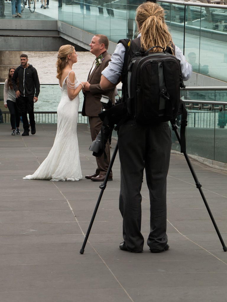 The wedding  photographer and his clients